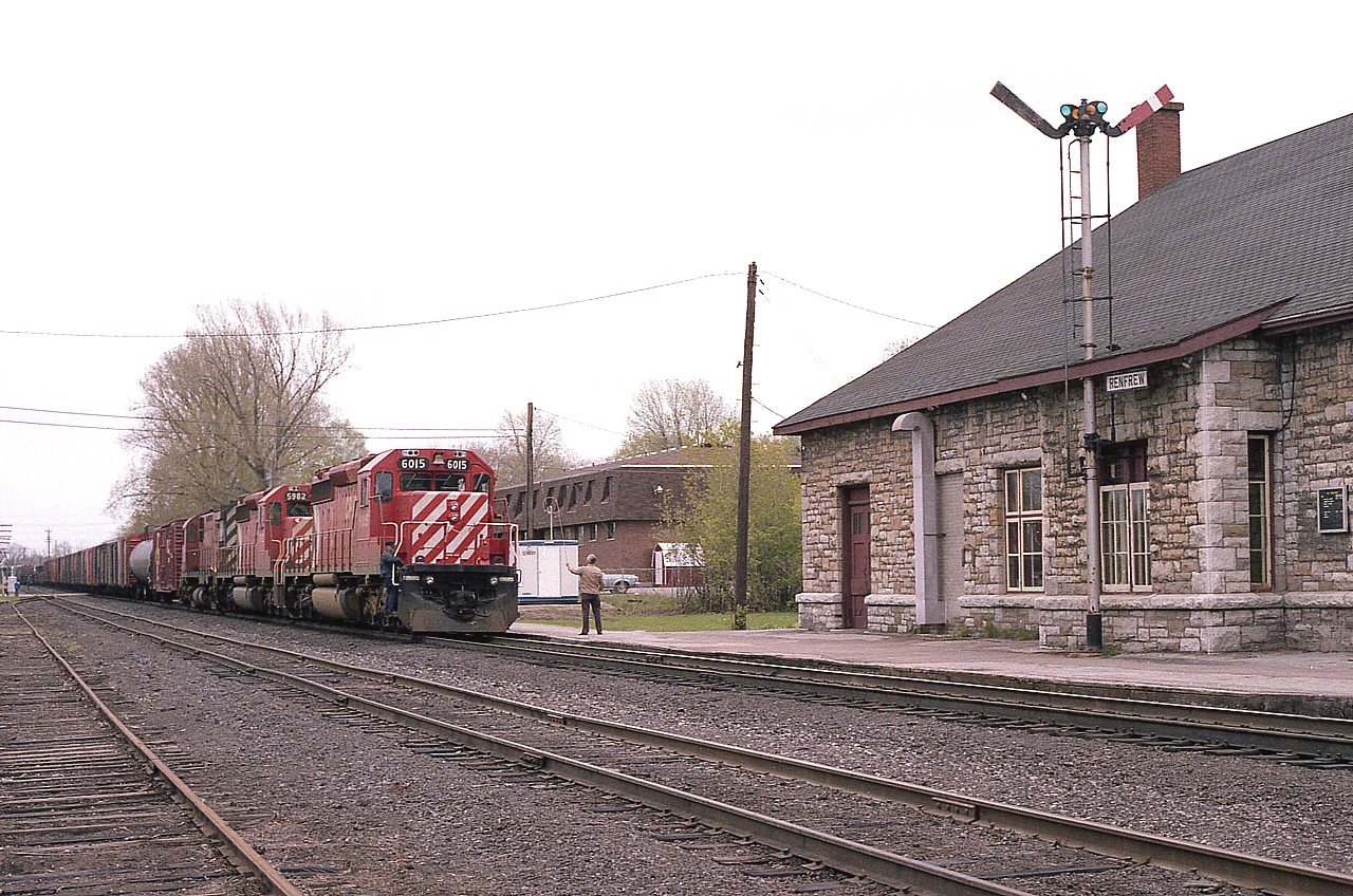 The station agent has the orders hooped as the westbound CP slows down; apparently there was work in town. This scene has vanished into the history books, as the station was demolished the following year, the very last train ran thru here in 2009 and the track was removed by late 2011.  Thus the Ottawa Valley line became another part of railroadings dark past. In this view we see CP 6015, 5982 and 4244. Such the beautiful station at Renfrew. Sadly, the demolition of similar stations at Alimonte, Arnprior and Pembroke preceded loss of this one.