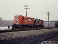 CP RS18 units 8734 and 8736 leave their train on the connecting track off the TH&B Waterford Sub as they make a setoff for Conrail on the CASO Sub at Waterford. After, they'll presumably couple back onto their train of TH&B gondolas, reverse, and cross the old LE&N bridge in the background over the CASO to continue their trip south to Nanticoke.<br><br><i>Bill McArthur photo, Dan Dell'Unto collection slide.</i>