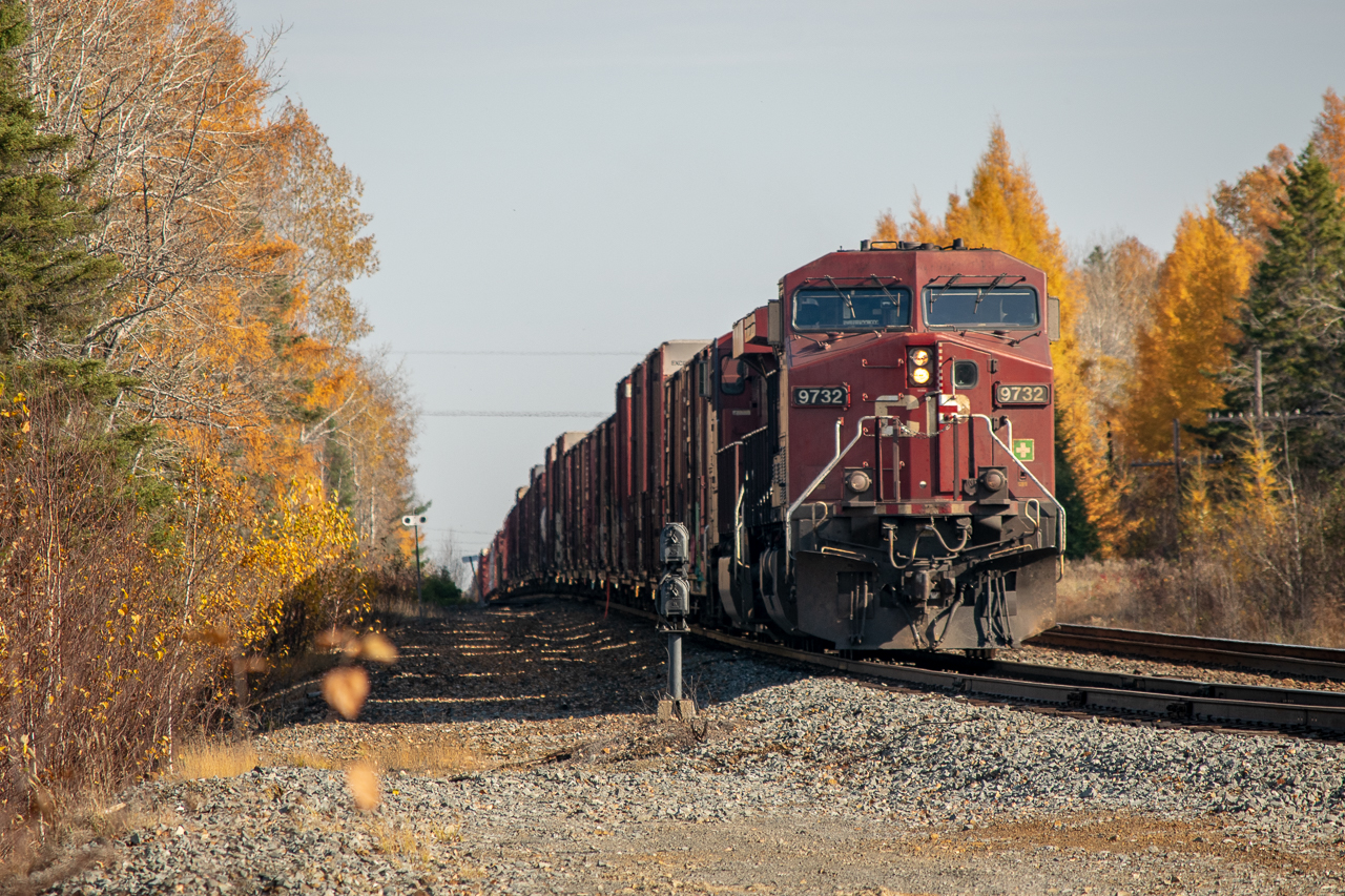 CP 421 I presume based on the cargo waits on a crew change at the west end of Larchwood. That hump in the ground just behind the head end is the edge of the meteorite impact crater that formed the Sudbury basin.

Incidentally, if you want to see this train in Google Maps, the StreetView car must have been by within an hour on either side of my visit. I was looking at StreetView today, saw a familiar train and decided to upload my shot.