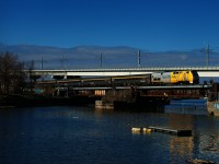 VIA 33 has a stainless steel consist (which it only has on Thursdays) as it crosses the Lachine Canal.