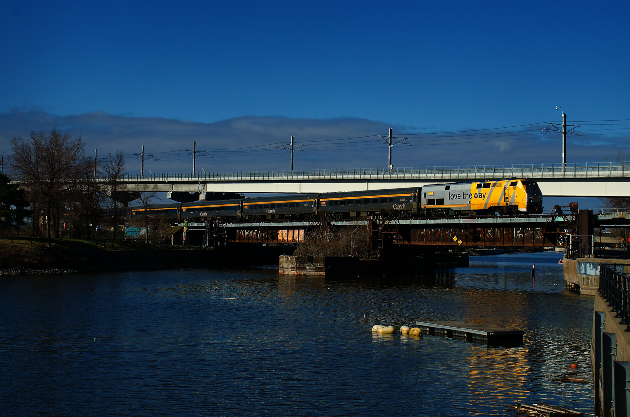 VIA 33 has a stainless steel consist (which it only has on Thursdays) as it crosses the Lachine Canal.