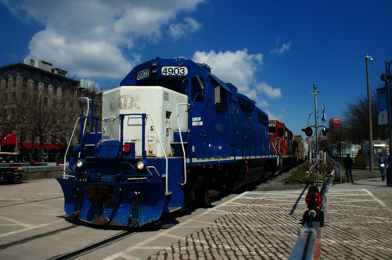 With a caboose tucked behind CN 4903 & CN 4731, the Pointe St-Charles Switcher is leaving the Port of Montreal.
