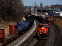 CN 527 has four units, including CN 9523 last as it rounds a curve and passes cars for CN 400 to pick up. 