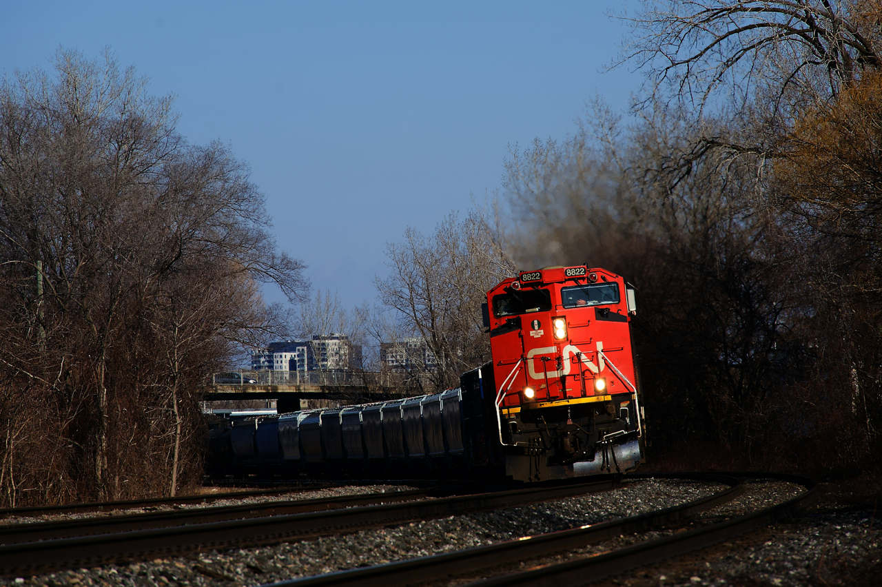 CN 527 is rounding a superelevated curve at MP 7 of CN's Montreal Sub after setting off cars on the Freight Track near Turcot Ouest.