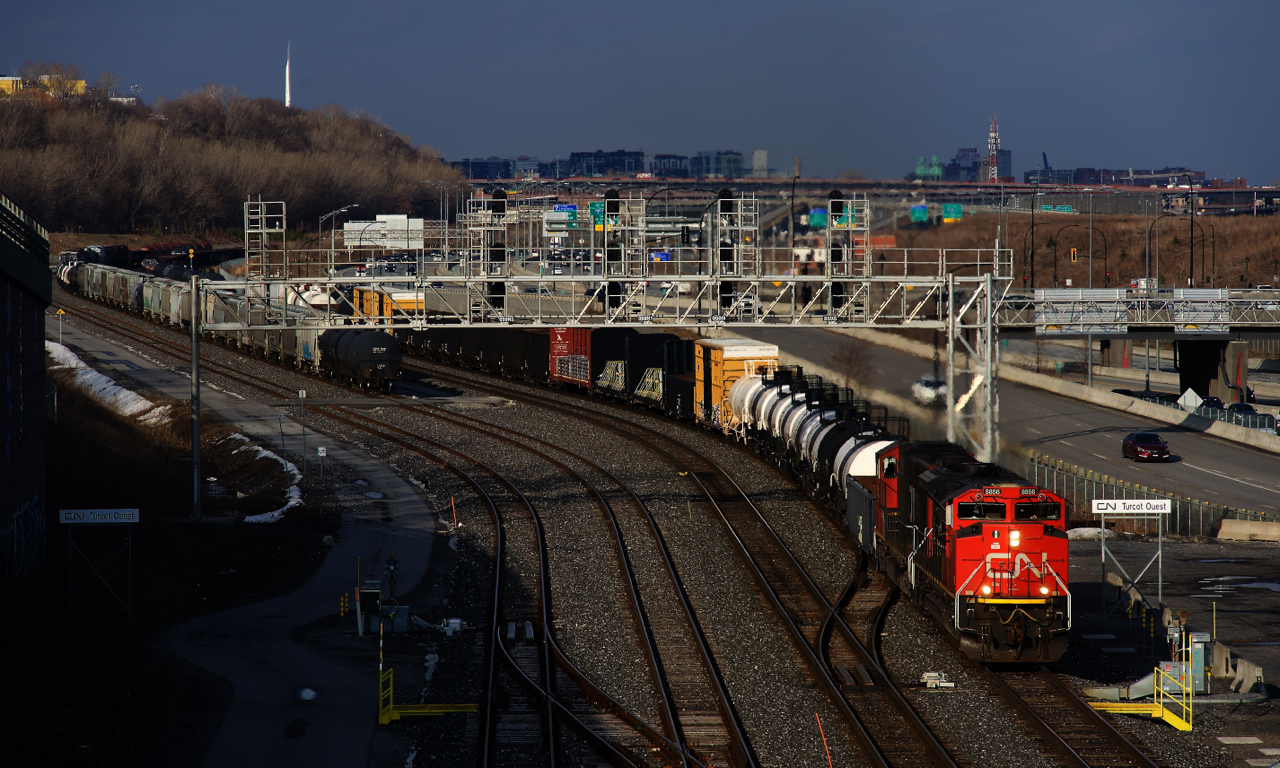 CN 321 is passing Turcot Ouest with a pair of EMD units for power. At left are cars set off earlier that day by CN 527. CN X309 was supposed to pick them up, but it would fall to the next edition of CN 321 to do so.