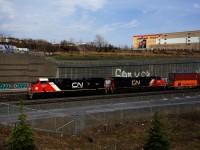 Freshly rebuilt CN 3315 leads CN X123 past Turcot Ouest.