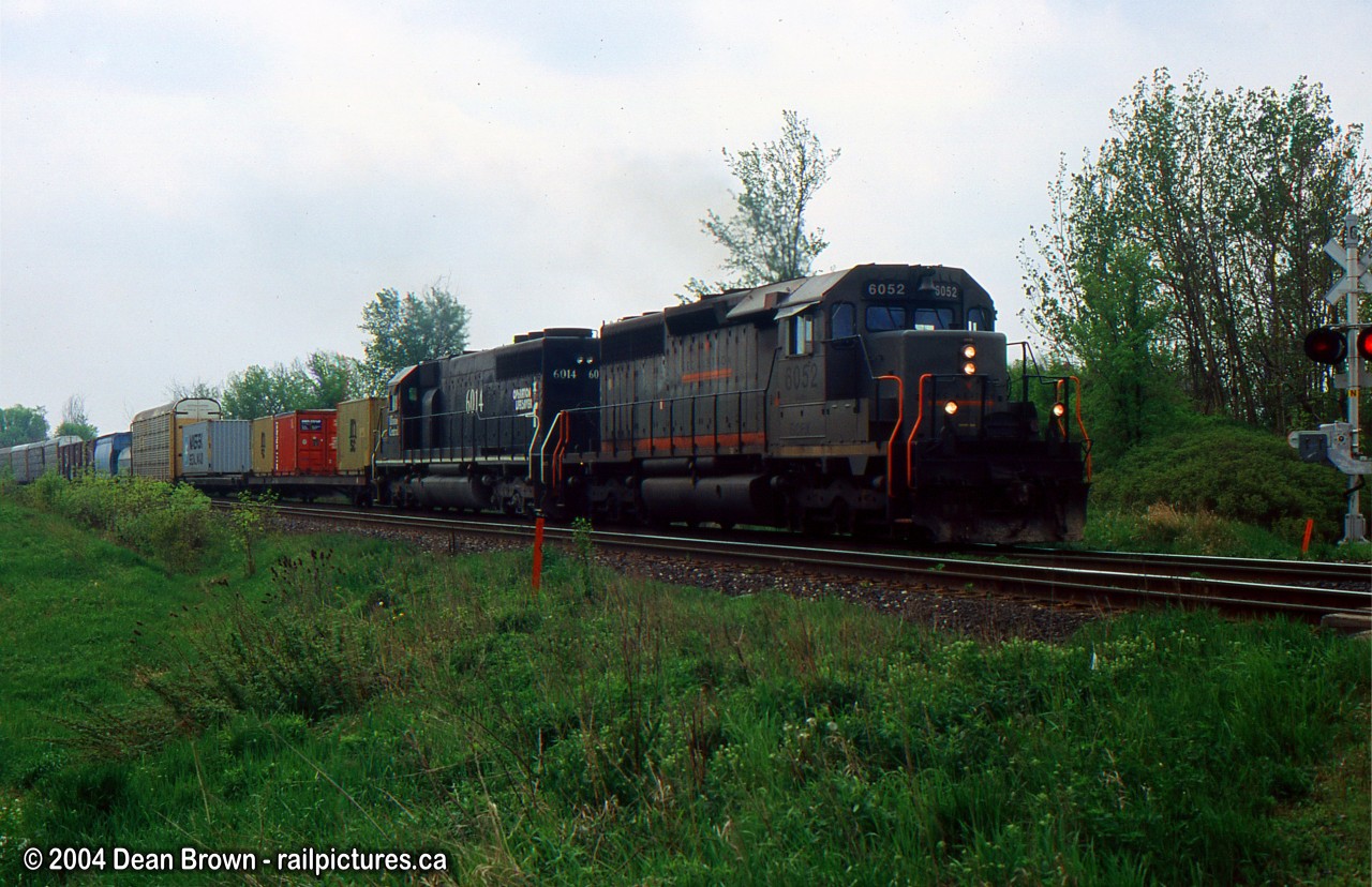 CN EB with GECX 6052 and IC 6014 heads eastbound on the CN Halton Sub towards Mac Yard.