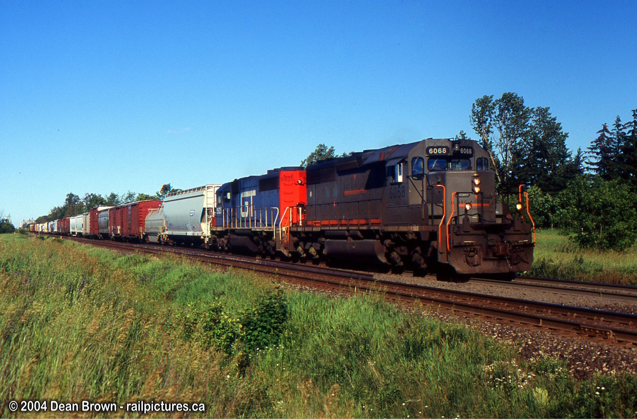 CN 339 with GECX 6068 and GTW 5925 eastbound approaching Georgetown on the hot sunny evening.