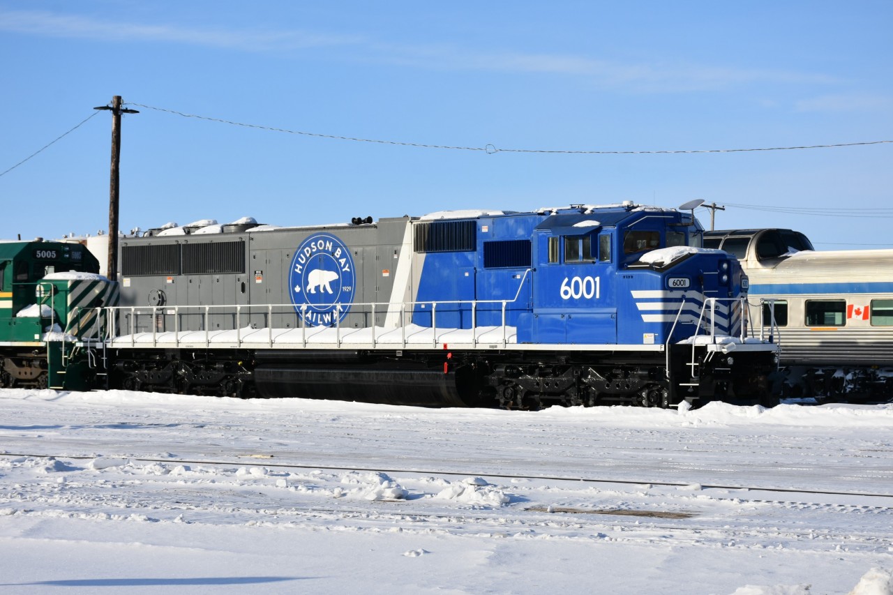 All but a couple of HBR's new 6000 series locomotives are parked at their locomotive facility in The Pas, MB on this cold March morning. Units I was able to see and/or photograph at the shop and yard were HBRY 824, 3001 (ex-CN 9438), 3002 (ex-CN 9465), 3003 (ex-CN 9478), 3078, 5000, 5004, 5005, 5007, 6001, 6004, 6005, 6008, 6009, 6011, and HLCX 3840. A GREX DumpTrain (GREX 2400) was also spotted. There were two complete GREX trains in Churchill when I was there last August so the second train is likely somewhere in the yard out of sight. What an interesting facility to visit! :-)