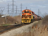 The SOR Garnet Yard day job with QGCY 2301 and RLK 4095 are trailing a block of coil cars for Stelco and a block of tanks for Imperial Oil has slowly made its way south from Garnet Yard and is stopped at Mile 0.00 Hagersville Sub. at Nanticoke the junction with the Stelco Spur and Hydro Spur. The crew is waiting the arrival of GEXR 2303 (Imperial Oil Job) which is behind the photographer running light northbound on the Hydro Spur. The crew has lined the switch for the Stelco Spur, after a job briefing between crews QCRY 2301 and RLK 4095 will head south with the block of coil cars on the Stelco Spur, having cut-off the block of tanks to be lifted by GEXR 2303.   