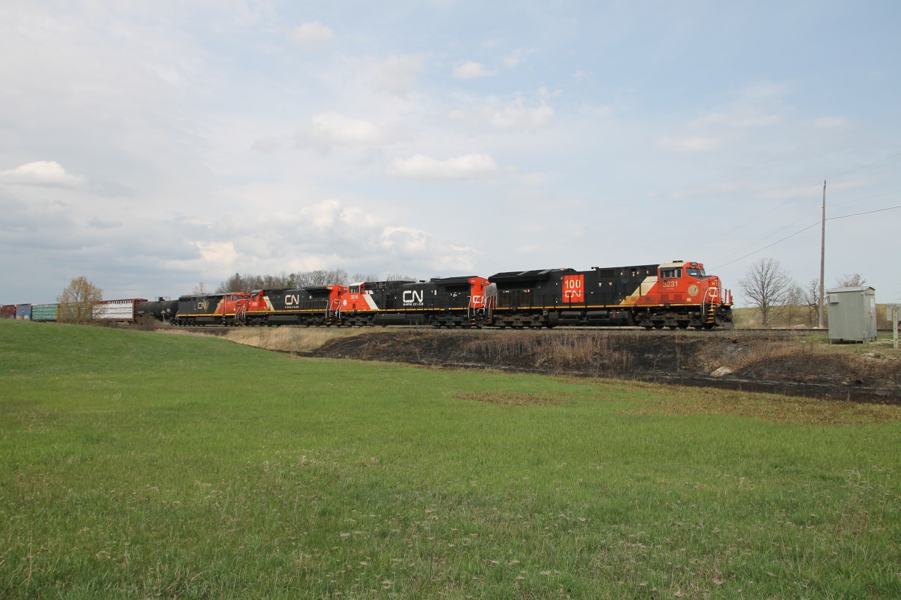 CN 3231 and CN 3316 are in the lead with CN 2122 and CN 2452 dead-in-tow as 397 passes one of the non-prescribed burns which occurred on the Halton Sub. yesterday. I presume the DIT units are heading state side for final disposition.