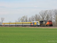 CN P27691 18 is seen on the approach to Mandaumin shortly after departing Sarnia. Having captured the first trainset entering Canada, and some testing on the Chatham Sub (both at night), it was nice to see one of these new Siemens sets in the daylight. I must admit, they look pretty sharp.
The consist of this delivery extra is:

CN 3087, SIIX 2204, SIIX 2603, SIIX 2703, SIIX 2803, SIIX 2303, SIIX 2903