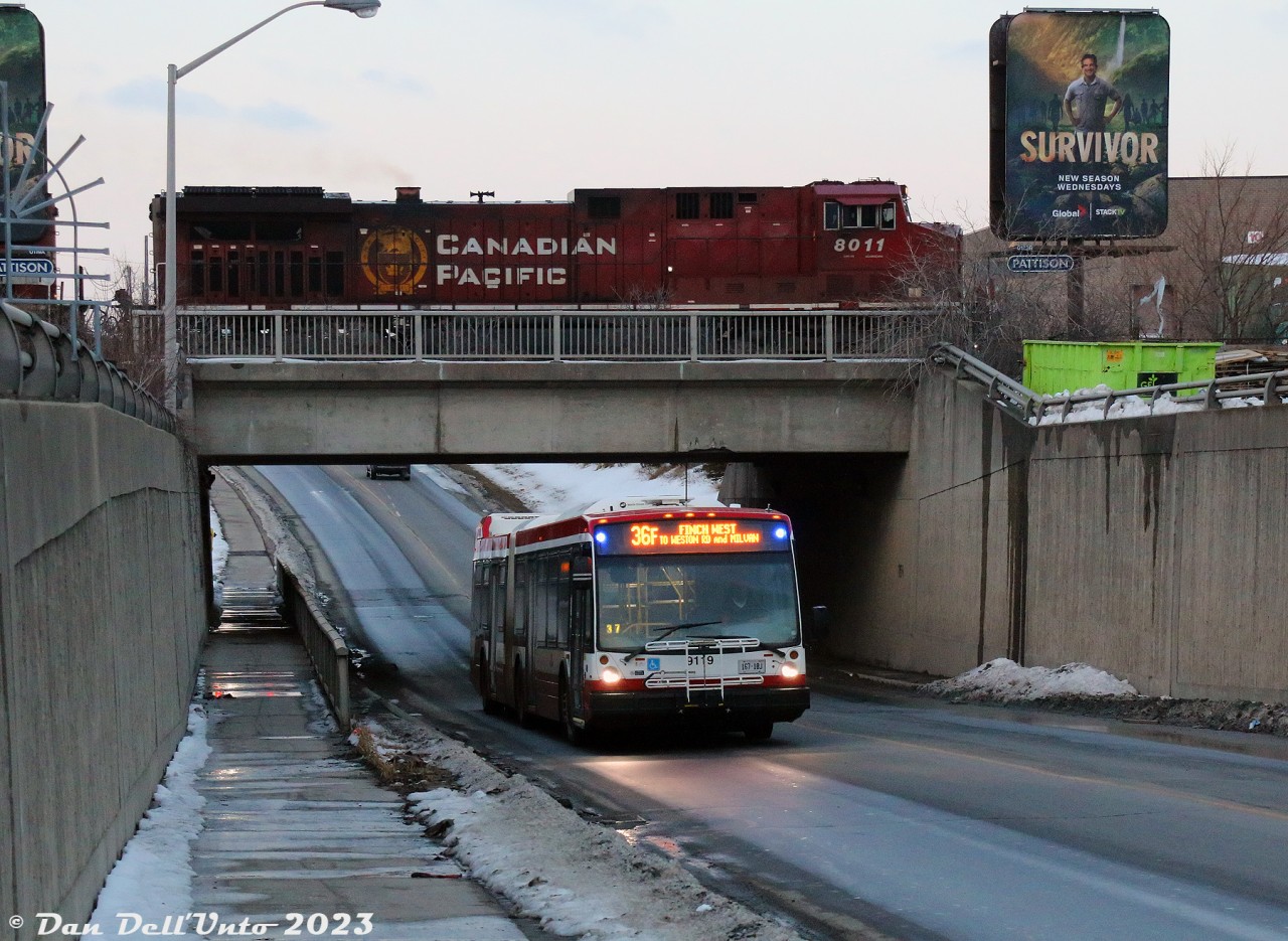 We didn't catch the bus, but at the same time, we did: TTC 9119, an articulated Nova LFS bus of no notable significance, dips under CP's MacTier Subdivision as the final light of the day fades. Above it, CP AC4400CWm 8011 just happens to plop itself into the photo on a southbound manifest freight, at the right time for once. Thanks CP. Shutter goes click click click for good measure. A good time was had by all (smoke 'em if you got 'em).

Hanging around an industrial wasteland of ill repute in the middle of nowhere pays off sometimes (notably on days you don't get run over by an errant cement truck). Maybe the old farms that used to be in this area, paved over by industrial lots decades ago, have some lucky horseshoes buried under them somewhere (next time, rest assured, we'll bring a shovel and maybe find out).
