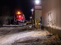 The CP Agincourt yard East job is doing some midnight switching along a spur just north of Toronto yard. They are drilling the Owen's Corning fiberglass industry and would end up taking 5 hoppers out of the small yard back to Agincourt. I don't think the crew was too pleased to have some foamers running around at 1am but we tried our best to keep them out of our photographs. CP 4451 & CP 3033 provide the power. 
The spur name in the description is a guess, a general description of the area. 