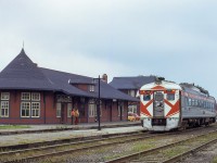 Canadian Pacific RDC-1 9061 pauses at Orangeville during a Toronto - Owen Sound excursion.  Facilities including the 1906 station, bunkhouse, and freight shed fill out the scene.  Seeing its last regularly scheduled train on October 30, 1970, the station would remain on this site into the mid-1980s when it was relocated a few blocks north to 35 Armstrong Street.  Over the last three decades it has played host to various restaurants, most recently the <a href=https://pbs.twimg.com/media/EEV8eEuWsAAwOaQ?format=jpg&name=large>Barley Vine Rail Co.</a>  The Orangeville bunkhouse, originally built as a restaurant in 1943, <a href=http://www.railpictures.ca/?attachment_id=4386>survived into the OBRY era</a> before succumbing to a fire <a href=http://www.trainweb.org/oldtimetrains/CPR_Bruce/bunkhouse.htm>on March 21, 2006.</a><br><br><i>CPR 9061, built in 1957, would be sold to VIA in 1978 and rebuilt to VIA 6142 in 1981.  6142 was part of a batch of thirteen RDC-1s purchased by Dallas Area Rapid Transit (now Trinity Railway Express) in 1993, being renumbered <a href=http://www.rrpicturearchives.net/showPicture.aspx?id=5652560>to TRE 2002.</a>  Ten of these thirteen RDCs were <a href=http://www.railpictures.ca/?attachment_id=30218>sold in 2017 to AllEarth Rail of Vermont as AERX 2002.</a> <a href=https://www.allearthrail.com/>AllEarth Rail</a> is a passenger equipment company aiming to develop passenger services throughout the state.<br><br><i>Ken B. McCutcheon Photo, Jacob Patterson Collection Slide.</i>