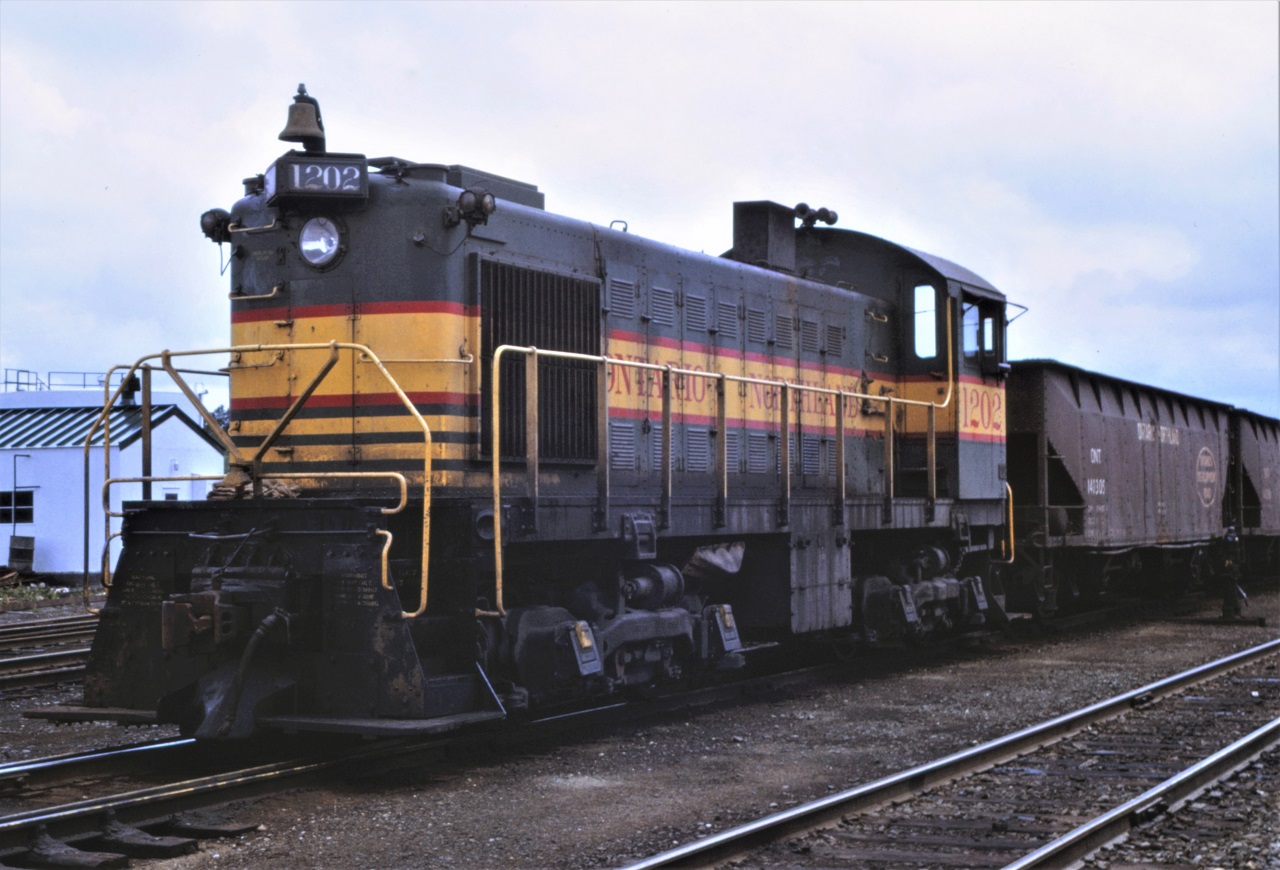 Ontario Northland 1202 builds a train in their North Bay, Ontario yard on September 1st, 1969.  The unit was built by ALCO in June 1946 S/N 74481.