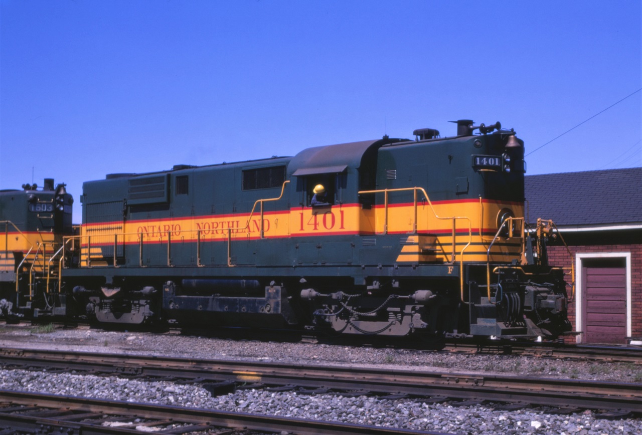 Shop staff at Ontario Northland's North Bay, Ontario facility, shuffle units around.  ONT 1401 is an RS-10 built by MLW in December 1955 with S/N 81482.