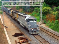 CN EB with HLCX SD45 6413 and two CSX SD40s pass through the plant at Snake Rd. en route to MacMillan Yard back in the days when CN had a lot of lease and run-through power.