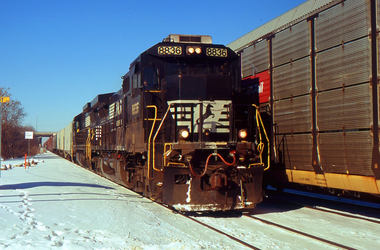 NS 328 with NS 8836 creeps up to Nelles Rd. as they meet 332 going westbound on the north track through Grimsby.