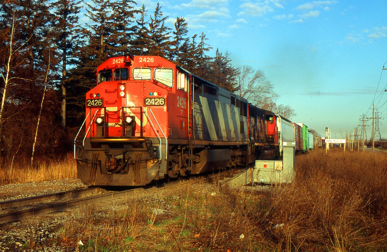 CN 421 with CN 2426 and CN SD40-2(w) 5282 at Nelles Rd. on the CN Grimsby Sub after meeting with NS 327.