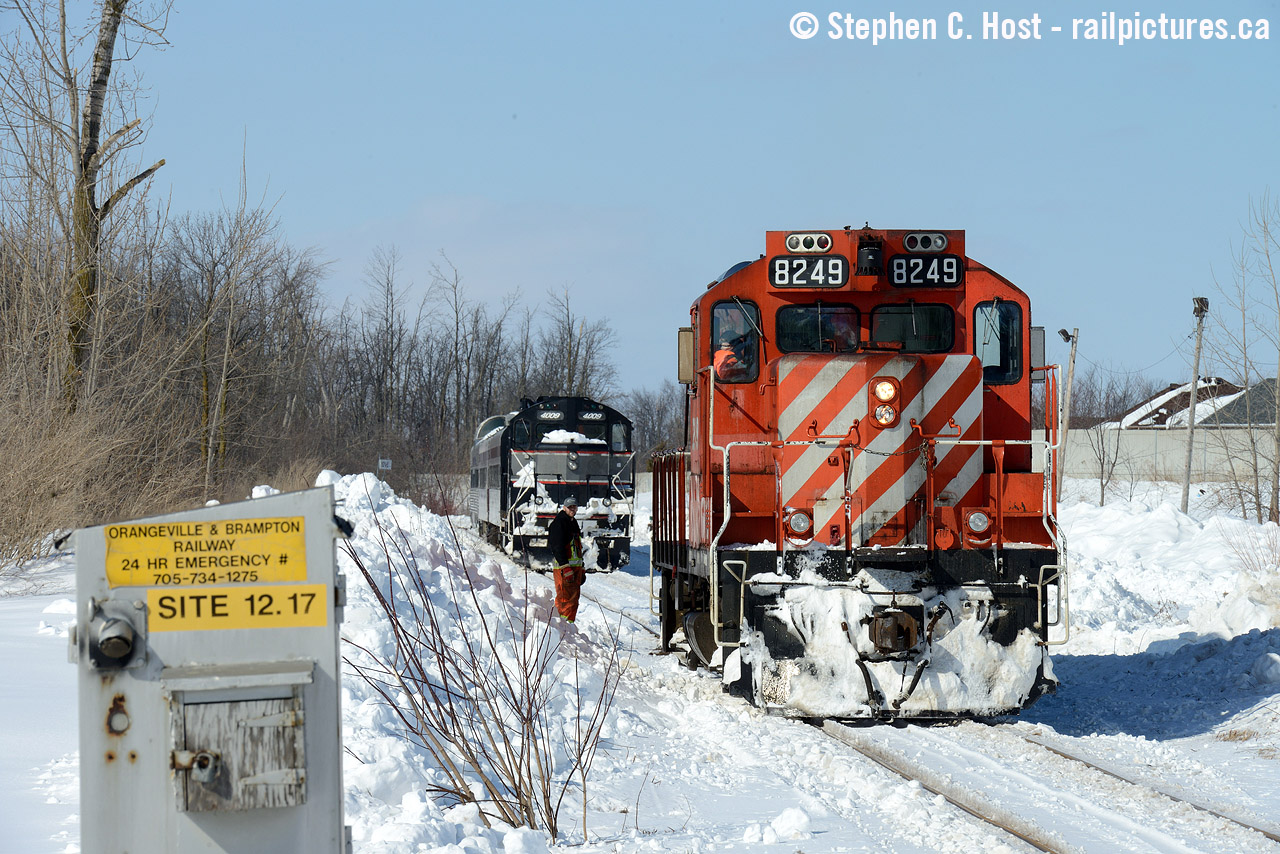 The OBRY's "snow Train" with CP GP9 8249 in charge about to run around the train in Snelgrove before heading back long hood forward to Orangeville. This was an amazing event and to think only about 4-5 of us were out photographing this.. today - this would be far far busier.

The short form of the story is this: After CCGX 4009 died earlier in the week, CP had to loan a unit to the OBRY to continue their operation. Also, on the weekends, the "snow train" was scheduled to run. A CP Geep on a passenger train? I had to go see this for myself. What made this train extra special is the OBRY had a dome and a fourth coach (RDC-9) on site, the train line was frozen, thawing it out was not working (it was very cold) so instead of switching everything out the 4009 and the dome had to go along for the ride. One of the coaches was even painted in CN on one side for a movie shoot  "as seen in this picture"(click to see) Unfortunately the CN side was only sunny for this one shot. But the views were nothing short of  Breathtaking (Forks of the credit - click to see) as usual. It's a shame this line is done for, it would have made an amazing tourist line.
The 8249 died that day and CP had to send another unit - so they sent brand new 2267 and, a week later, I had to be there to see it lead the train again.. Two years later CP would loan another ECO and it would be used in freight service for a couple weeks. It never happened again. After Trillium took over the CP loaner agreement was still in place but it was never needed and of course, Mayor Brown killed the railway at all costs with the Last train in December 2021 (Lion Liu). Lots more on this site if you want to find more - we covered this line a lot. Regular OBRY hogger  Steve Bradley has photos going back a few decades on his profile. Check it out.