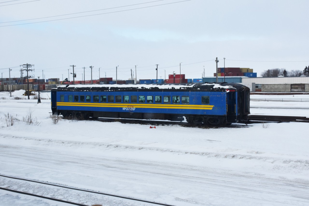 Prior to capturing some ex-VIA, exx-CN passenger equipment on the Pukatawagan Mixed in The Pas, MB in March of this year, I snapped RPCX 5307 (ex-VIA 5307, exx-CN 5307) Class PA-74-F, 74' 0" First Class Car (coach) sitting all alone in the middle of the CN yard in Saskatoon, SK. With candy canes over the running number, and a Santa hat with Ho Ho Ho over the vestibule door opening at right, it appears this car may have been on some kind of Christmas excursion, or Santa Train prior to being parked. Hadn't seen VIA blue equipment in service for years, then BOOM!, twice in less than 60 days!!! The only thing missing from this photo is sunshine & blue sky. :-)
