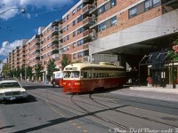 TTC PCC 4545 (A8-class, CC&F 1951) on the Route 502 pulls out of McCaul Loop, out from under Village by the Grange, and onto McCaul Street to head south. At Queen, she'll turn east and cross the city bound for Bingham loop.
<br><br>
The "Village by the Grange" is late 70's mixed use office/residential/commercial development along McCaul between Dundas and Queen Streets. Part of it was built over the old TTC McCaul streetcar loop, that was reconstructed to loop inside/underneath part of the building.
<br><br>
But that wasn't all the streetcar content: as part of a restaurant (Applebee's) located by the streetcar loop, a pair of old Peter Witt streetcars were supplied by the Ontario Electric Railway Historical Association (OERHA, today the HCRY) to the developer for incorporation. According to the trackside guide, one was ex-TTC Peter Witt 2806, and the other was ex-Ottawa Transportation Commission Peter Witt 829. The TTC Witt, one of the last bunch in TTC service (retired circa 1965) was purchased by private owner Charles Matthews after retirement. It was in rough shape when the OERHA acquired it, likely why they let it go (the trucks and usable components were removed as parts for their other streetcars). Both of the Applebees Witts lasted into the 90's, but at some point after were removed when the restaurant location was renovated.
<br><br>
<i>Original photographer unknown, Dan Dell'Unto collection slide.</i>
