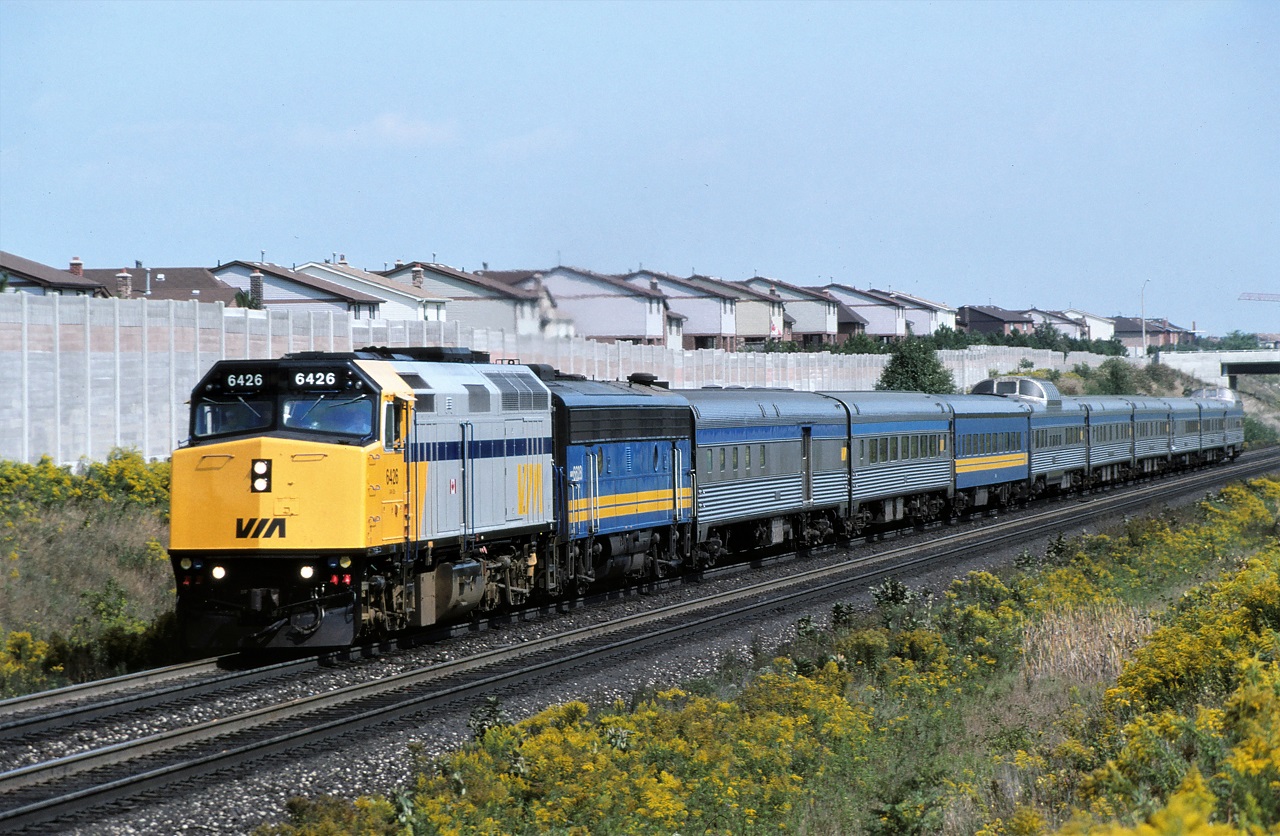 NINE ON NINE!!!  The Toronto Section of the Canadian heads west along CN's York Sub as it begins its long voyage to Vancouver.  Power for the train is the 6426 and 6628.