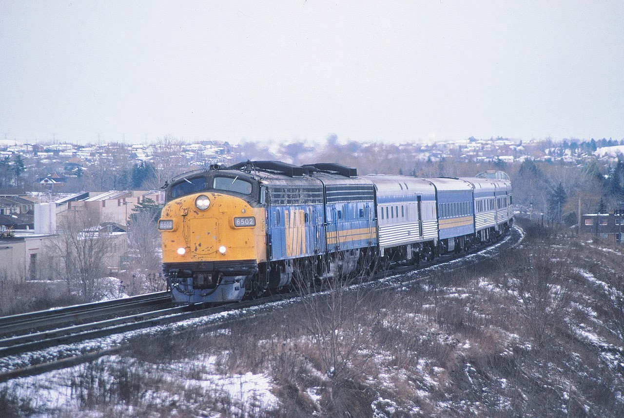 On an overcast and otherwise crappy March day in Toronto, the Toronto section of the Canadian, train 9, heads west on CN's York Subdivision just east of Yonge Street. Power is an A-B combination of former CN units, 6502 and 66xx, for the 6 car train.