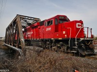 On its way to Havelock and Blue Mountain to serve the nepheline syenite mine, CP train T08 crosses the Otonabee River bridge (built 1913) in downtown Peterborough, on April 11th, 2023. Today's long train is powered by three locomotives, led by GP20C-ECO 2231. 
