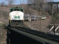 (Peter Jobe photo) GO 703 with train #984 is southbound in the Don Valley at MP 8.9 in Toronto in April 1980.