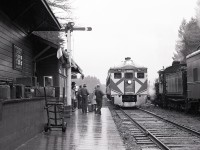 For filming of a portion of the movie The Grey Fox, ex MacMillan Bloedel number 1077 now British Columbia Provincial Museum 1077 was used to simulate a CP steam locomotive hauled train at “Kamloops” using the original E&N now CP depot at Parksville on Vancouver Island on Friday 1980-11-14.  The regular southward passenger train No. 198 with RDC-1 CP 9064 arrived at 1410, precisely on time (of course, that’s just how we operated).  Note the chalked arrivals and departures board for “Kamloops”.

<p>That depot remains in place to this day, now occupied by the Arrowsmith Potter’s Guild, and the young lady from the Wellcox yard office in Nanaimo who accompanied me that day on our first date is with me to this day, too!