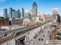 The New Look Of VIA. On the morning of April 4, 2023, VIA Rail Canada Train 33 (Quebec City, QC-Ottawa, ON) was assigned a Siemens Venture train set, seen being led by Cab Car SIIX 2301 (consist: coaches 2901, 2801, 2701, 2601 and locomotive SCV-42 2202) as it departs Gare Central in Montreal, Quebec. VIA has ordered 32 of these train sets to equip its inter-city fleet. The tracks to the left of frame show the ongoing construction for the new REM (Réseau express métropolitain or Metropolitan Express Network) a fully automated light rail system that will significantly change the transit options in the Montreal area. 