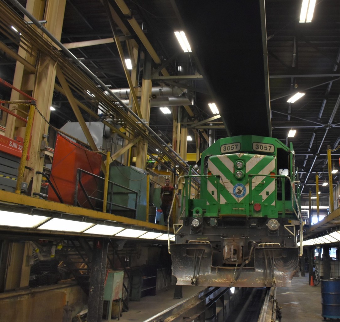 CMQ 3057 sits on one of the elevated diesel shop service tracks inside the ONR's North Bay, ON locomotive repair facility on April 13, 2023. Access to all areas of the locomotive for service, maintenance, and repairs is possible in this multi-tiered area of the building.
