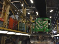 CMQ 3057 sits on one of the elevated diesel shop service tracks inside the ONR's North Bay, ON locomotive repair facility on April 13, 2023. Access to all areas of the locomotive for service, maintenance, and repairs is possible in this multi-tiered area of the building.