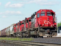 Looks like some low-down photographer slipped into the yard by the GO/VIA station at Aldershot, but in actuality the fence was not extended far enough to prevent me from tippy-toeing around at the end of it and shooting a telephoto image.   Wondering if this train was one returning to Stuart St yard in Hamilton. Power is 6001, 4110, 4122 and 4137.