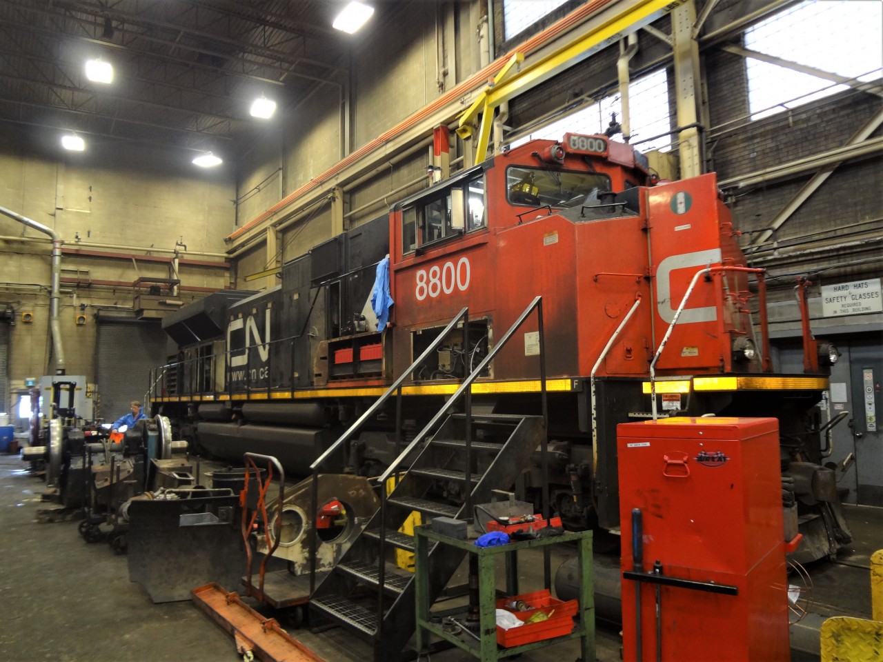 With numerous doors and hatches open or removed, it appears CN 8800 is in for some serious maintenance and or repairs at the ONR diesel shop in North Bay, ON.