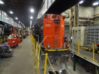 CN 8880 sits on one of the elevated service tracks across the aisle from sister CN 8886 and an unidentified ONR unit inside the ONR diesel shops in North Bay, ON January 24, 2020. There is no room for deviation from specified dimensions when moving locomotives and other equipment into this part of the facility.