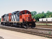 CN 585 with 4116 and 4728 prepares to switche industries in Brantford, Ontario seen arriving in the yard on the Dundas Subdivision.  At the time, this local operated from London as far east as Paris and Brantford, usually making an appearance during the afternoon. HLCX 113 and RaiLink 1751 were the Southern Ontario RaiLink power in the yard in Brantford on this day. 