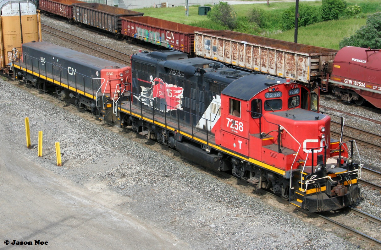 CN GP9RM 7258 and GP9 Slug 280 are seen switching at CN's MacMillan Yard in Vaughn, Ontario just north of Toronto, from the Highway #7 overpass. June 5, 2022.