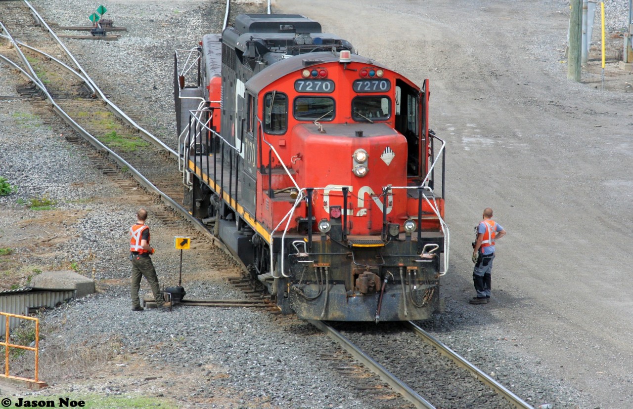 CN GP9RM 7270  and GP9 Slug 218 are seen switching at CN's MacMillan Yard in Vaughan, Ontario just north of Toronto, from the Highway #7 overpass. June 5, 2022.
