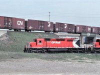 In a not photoshopped photo, a northbound CP freight with 5725 leading ducks under a westbound CN freight at CN Humber on April 28, 1984.  