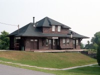 Another photo for the Station Gallery:  The former CP Kleinburg station is shown after it had been moved to a permanent location on the grounds of the Kleinburg Public School. Station has been fully restored and is now the "Railway Station Scout House". The original station was built approximately 1870 when the narrow gauge Toronto Grey & Bruce was pushing its way north from Toronto.  CP took over the line in 1883 and when this station burned, the one shown here was constructed in 1908. Kleinburg was by 1921 a stop for 13 passenger trains daily ! Time marched on, passenger traffic dwindled after Hwy 400 opened in 1952 and the station closed in 1964. In 1976 the freight house was torn down, and the station moved to where you see it now. Kleinburg is now part of Vaughan.
