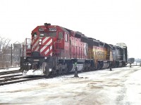 On a cold February day, the train has been put back together after working the yard and about to head westward.
Power was an interesting combination of CP 5533, Chessie (B&O) 3715 and CR 7777. I am standing near the Adelaide St. North crossing.