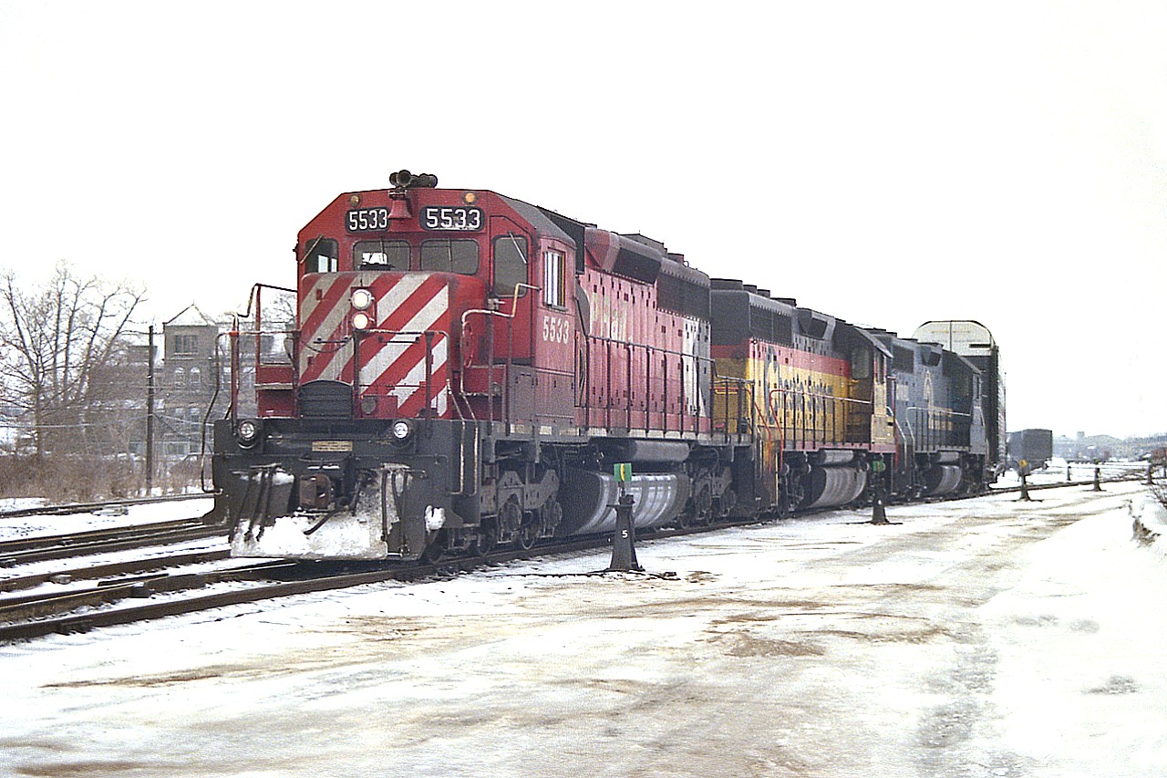 On a cold February day, the train has been put back together after working the yard and about to head westward.
Power was an interesting combination of CP 5533, Chessie (B&O) 3715 and CR 7777. I am standing near the Adelaide St. North crossing.