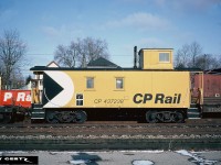 Photographed while waiting for trains on the CP Galt Subdivsion, CP wooden caboose 437238 is at Galt, Ontario in winter 1982. 