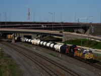 CN 2790 (ex-CREX 1422) & CN 3179 lead CN 321 as it passes the Turcot Interchange. Many decades back, Canada's largest roundhouse (56 stalls) was located roughly where the Interchange is currently located.