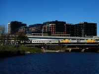 VIA 15's voyage from Halifax is almost over as it passes the Peel Basin with wraps VIA 6402 & VIA 6436.
