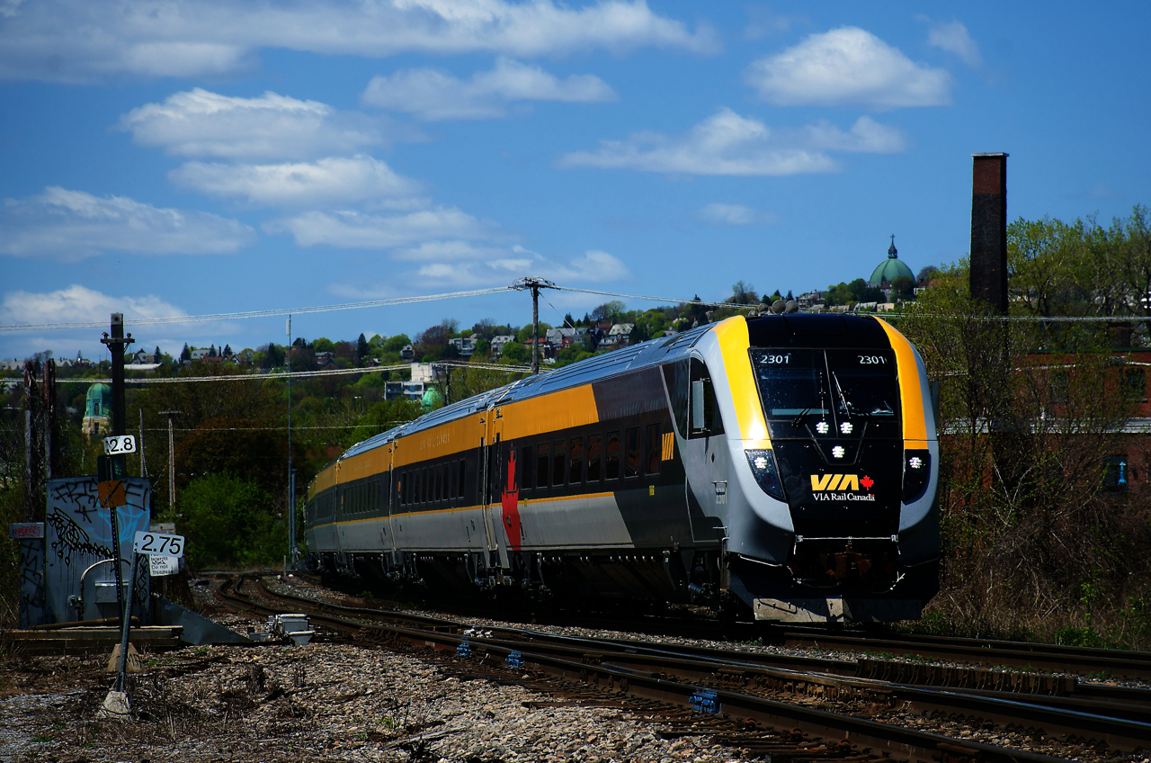 Now running between Ottawa and Quebec City on a more regular basis, a Siemens trainset is on VIA 24 as it heads east, with Mount Royal in the background.