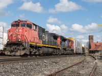 CN 435 is stopped at Brantford awaiting its conductor to walk to the head end to make the cut for them to begin their work.  Leading was a ratty C44-9LW.